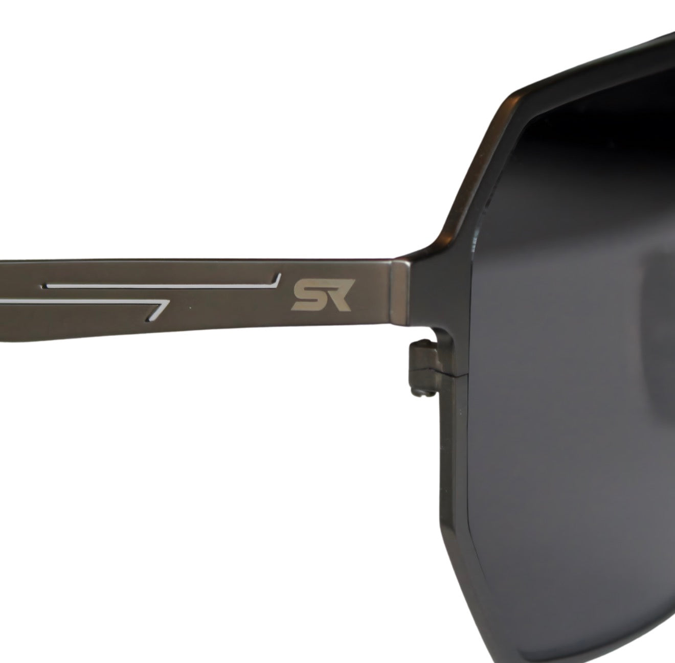 Close-up of SkyRift Vector sunglasses showing pure titanium gunmetal frame and engraved SR logo
