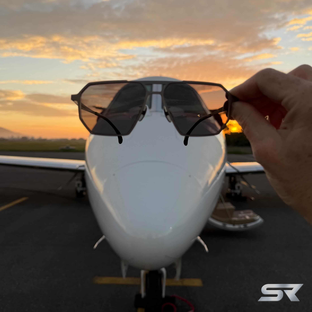 Skyrift eyewear aviation sunglasses in front of private jet